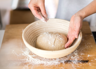 Sprinkling flour on bread dough.
