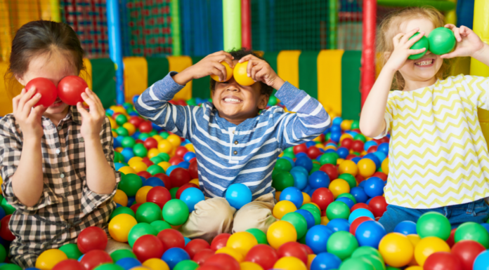 Kids playing in a ball pit.