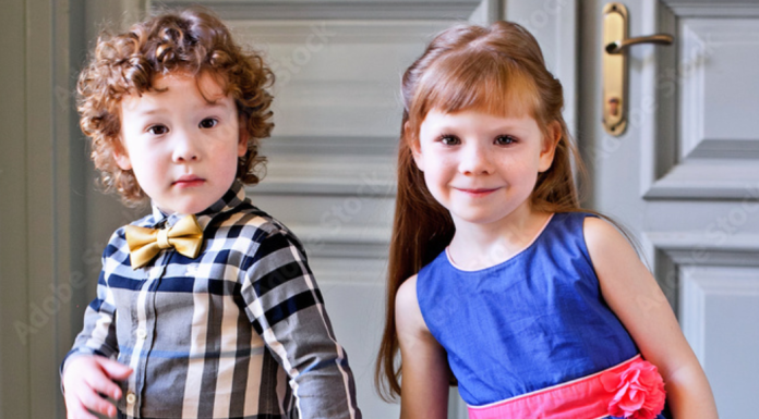 A boy and girl dressed up for a holiday celebration.
