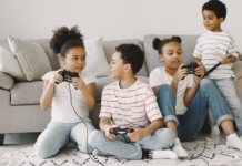 Siblings playing video games together.