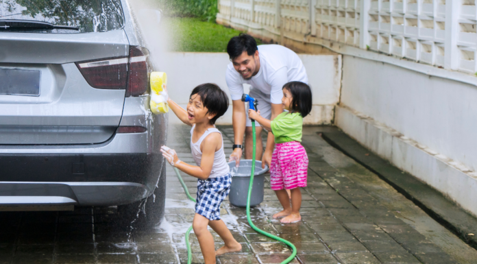 Kids helping their dad wash the car.