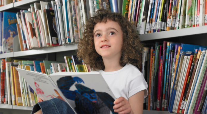 A girl struggling to read.