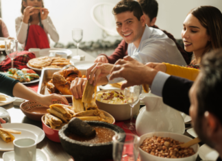 A family eating tamales on Christmas.