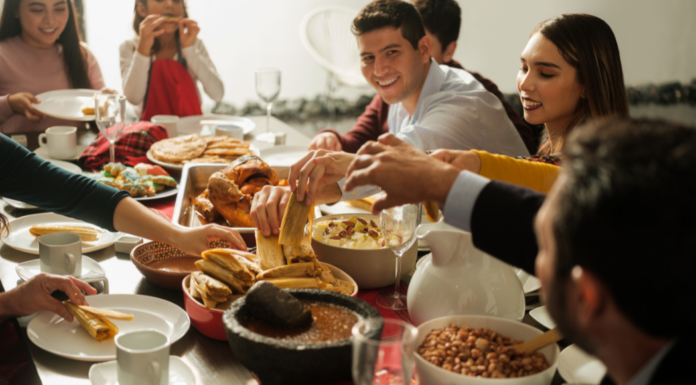 A family eating tamales on Christmas.