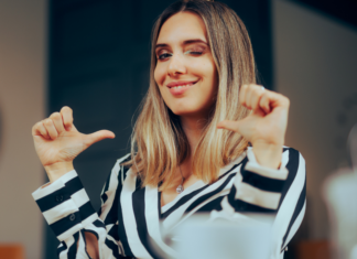 A woman with sideways thumbs.
