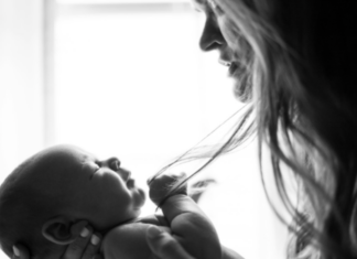 A woman holding a baby.