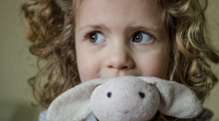 A girl with her bunny lovie.