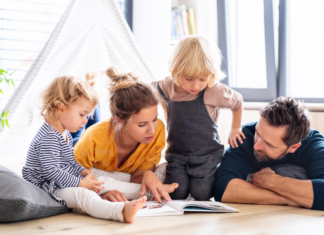 Building a Baby’s Library: My Favorite Children’s Books A family reading a children's book.