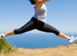 A woman leaping outside.