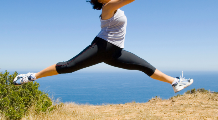 A woman leaping outside.