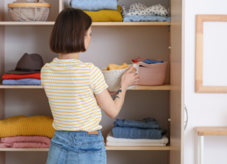 A woman cleaning out her closet.