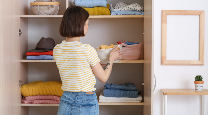 A woman cleaning out her closet.
