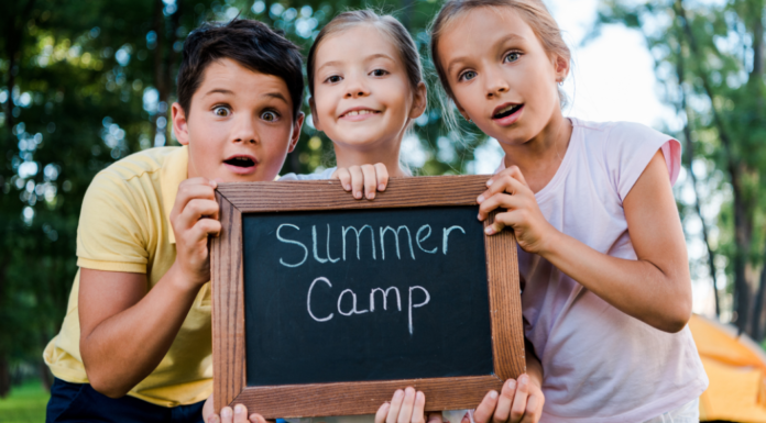 2026 Guide to Summer Camps In & Around Fairfield County Kids holding a summer camp sign.
