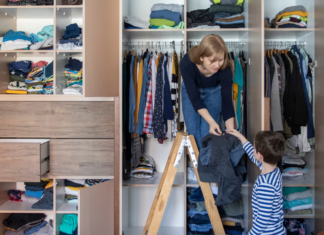 A mom organizing a closet with her son.