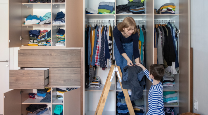 A mom organizing a closet with her son.