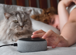 Someone in bed trying to turn off Alexa.