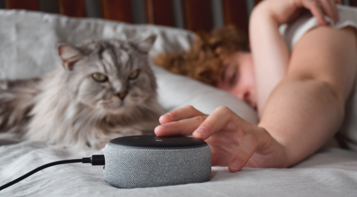 Someone in bed trying to turn off Alexa.