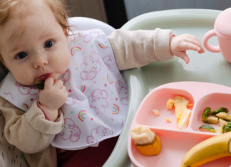 A baby eating food.