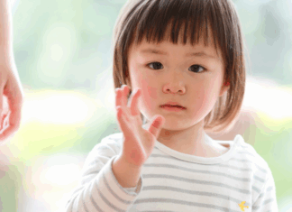 A girl waving goodbye.