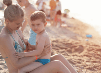 Only 18 Summers? A mother holding her son at the beach.