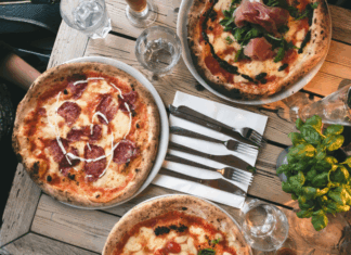 Fancy pizzas on a restaurant table.