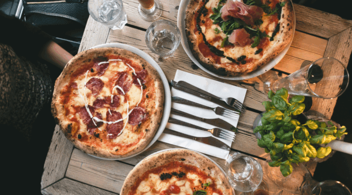 Fancy pizzas on a restaurant table.