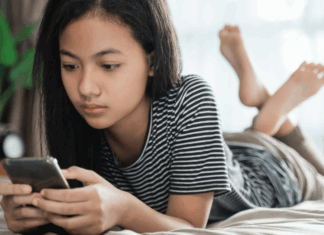 Middle school girl on a phone.