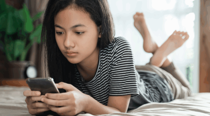 Middle school girl on a phone.