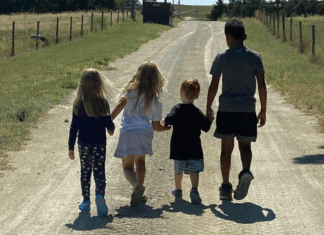 Cousins walking down a path.