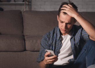A teen boy on the phone.