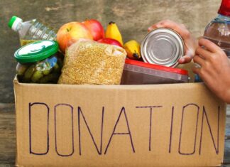 Food donations in a cardboard box.
