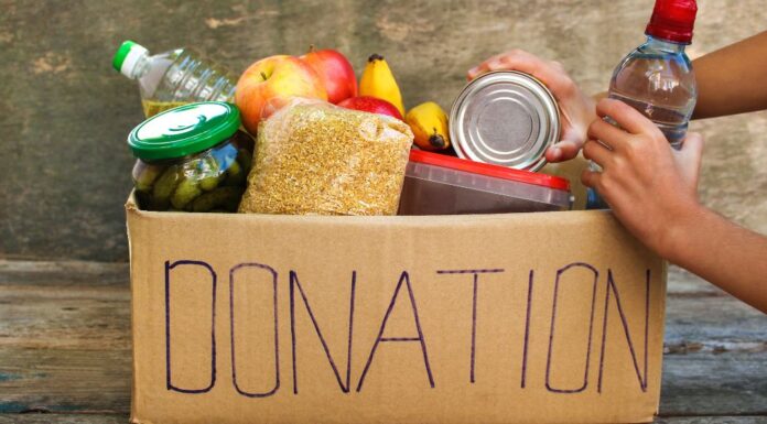 Food donations in a cardboard box.