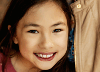A girl smiling.