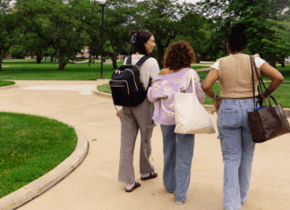 Girls walking on a college campus.