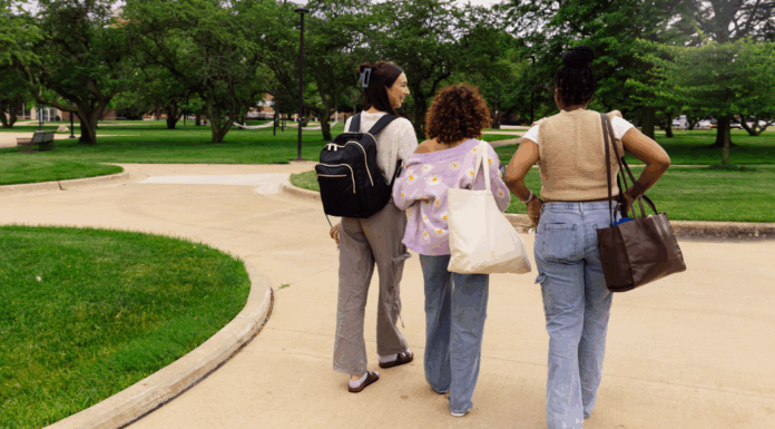 Girls walking on a college campus.