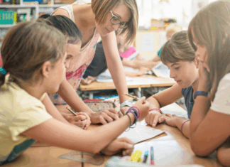 Kids working together in a classroom.