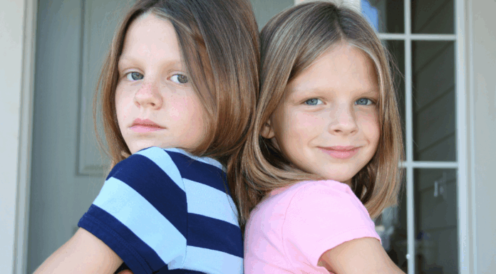 Sisters that have their backs to each other.