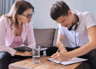 A mom working with her teen son.