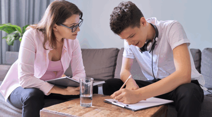 A mom working with her teen son.