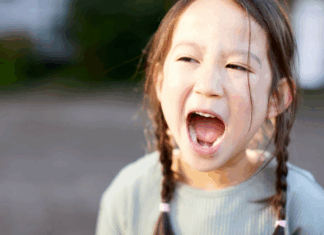 A girl screaming.