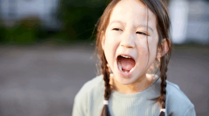 A girl screaming.