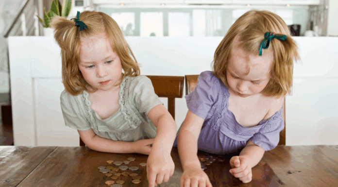 Twins counting change.