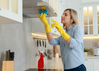 A woman cleaning the kitchen.