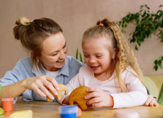 A mom role modeling through play with her daughter.