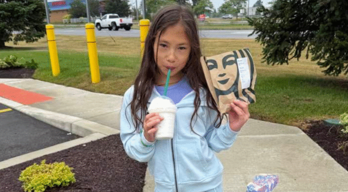 A tween drinking Starbucks.