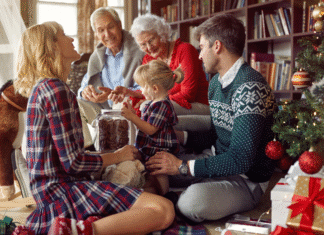 4 Tips for Creating Boundaries This Holiday Season A family opening presents on Christmas.