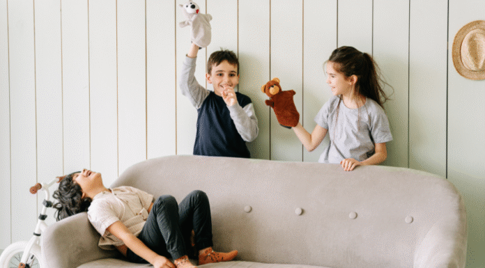 Kids playing with puppets.