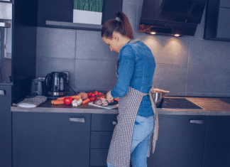 A woman cooking dinner.