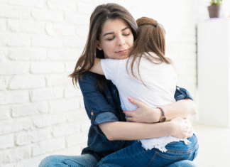 A woman hugging her daughter.