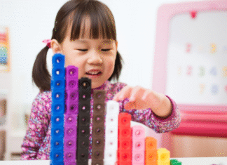 Confidence Comes Before Counting: A Message to Families with Little Math Learners A girl playing with math cubes.